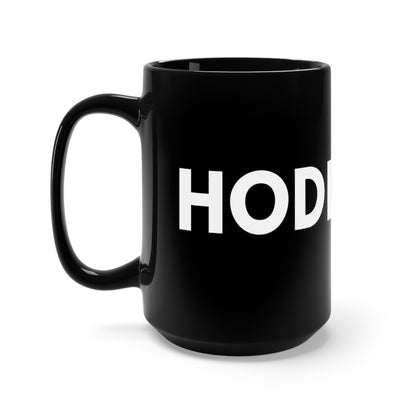 A black ceramic mug HODL written in white across the surface, C shaped handle, Memes for traders