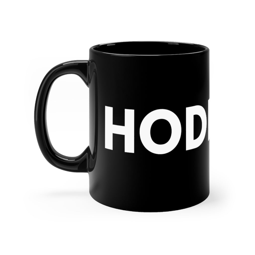 A black ceramic mug HODL written in white across the surface, C shaped handle, Memes for traders